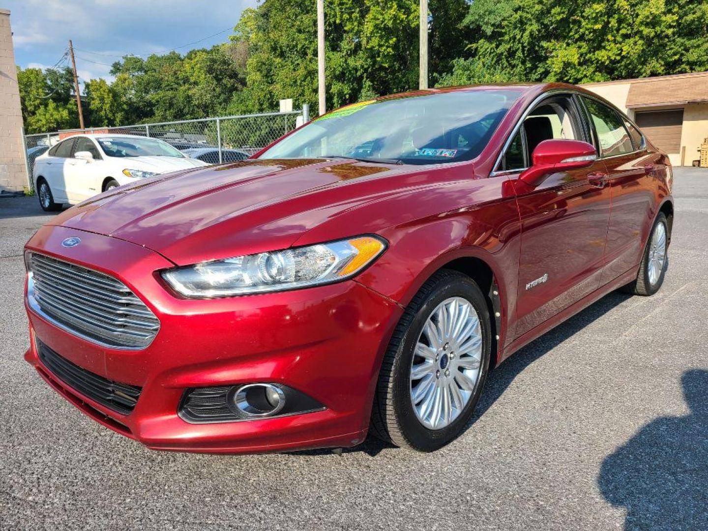 2013 RED FORD FUSION SE HYBRID (3FA6P0LU6DR) with an 2.0L engine, Continuously Variable transmission, located at 7981 Paxton Street, Harrisburg, PA, 17111, (717) 561-2926, 40.261490, -76.749229 - WE FINANCE!!! Good Credit/ Bad Credit/ No Credit - ALL Trade-Ins Welcomed!!! ***Guaranteed Credit Approval*** APPLY ONLINE or CALL us TODAY ;) Internet Prices and Marketplace Prices are SPECIAL discounted ***CASH DEALS*** Retail Prices are higher. Please call us to discuss your cash and finan - Photo#0