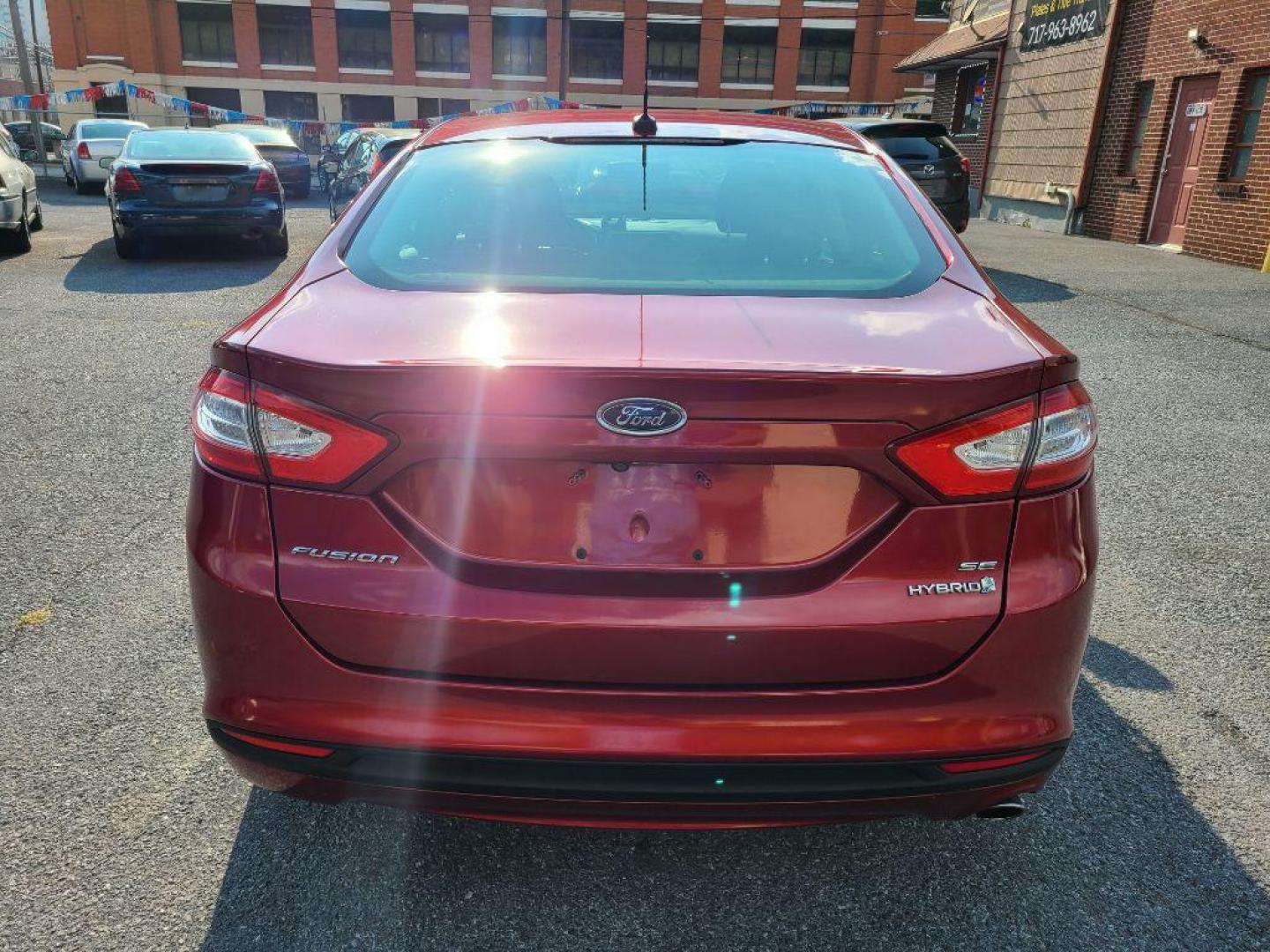 2013 RED FORD FUSION SE HYBRID (3FA6P0LU6DR) with an 2.0L engine, Continuously Variable transmission, located at 7981 Paxton Street, Harrisburg, PA, 17111, (717) 561-2926, 40.261490, -76.749229 - WE FINANCE!!! Good Credit/ Bad Credit/ No Credit - ALL Trade-Ins Welcomed!!! ***Guaranteed Credit Approval*** APPLY ONLINE or CALL us TODAY ;) Internet Prices and Marketplace Prices are SPECIAL discounted ***CASH DEALS*** Retail Prices are higher. Please call us to discuss your cash and finan - Photo#3