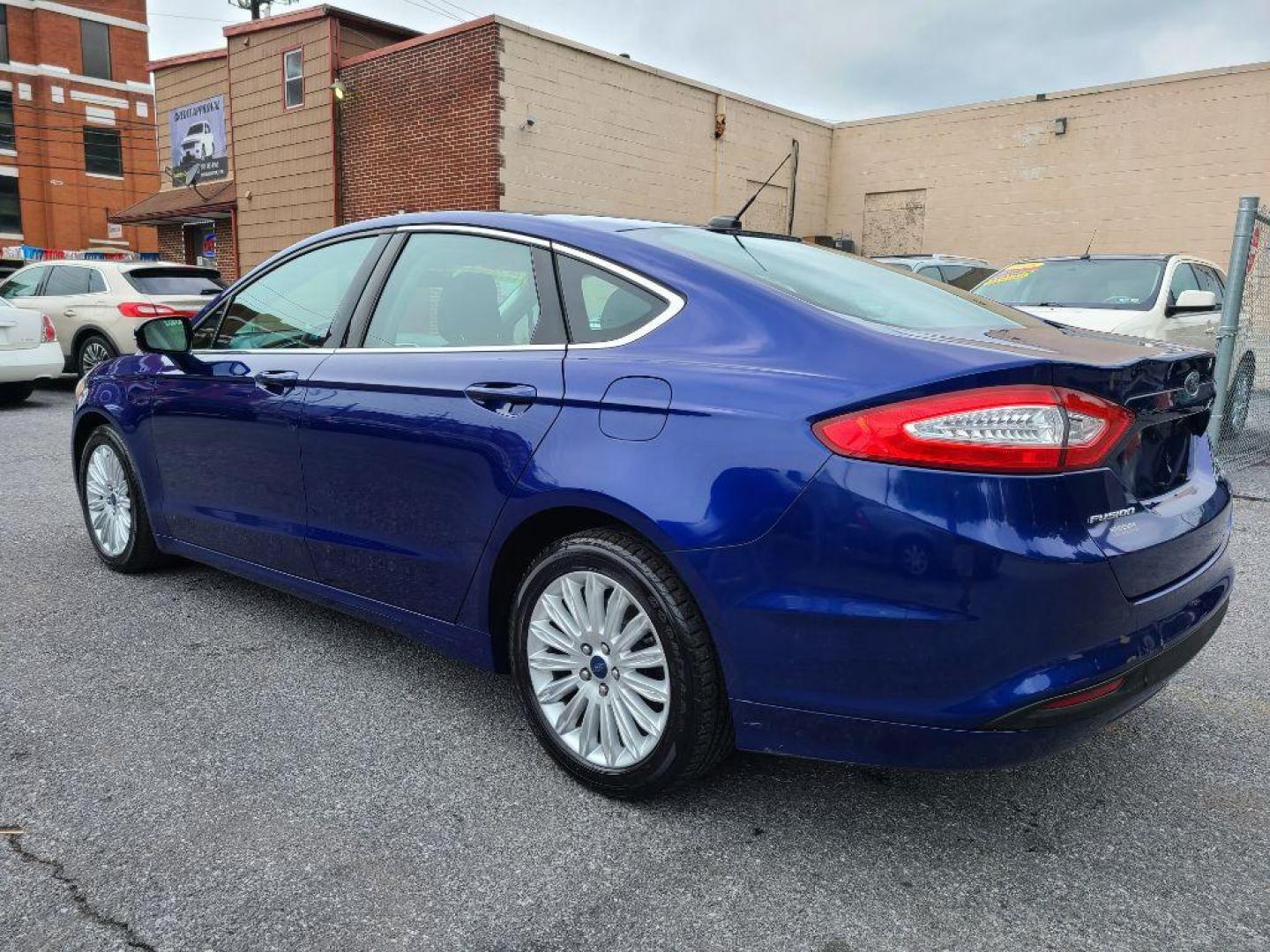 2014 BLUE FORD FUSION SE HYBRID (3FA6P0LU0ER) with an 2.0L engine, Continuously Variable transmission, located at 117 North Cameron Street, Harrisburg, PA, 17101, (717) 963-8962, 40.267021, -76.875351 - WE FINANCE!!! Good Credit/ Bad Credit/ No Credit - ALL Trade-Ins Welcomed!!! ***Guaranteed Credit Approval*** APPLY ONLINE or CALL us TODAY ;) Internet Prices and Marketplace Prices are SPECIAL discounted ***CASH DEALS*** Retail Prices are higher. Please call us to discuss your cash and finan - Photo#2