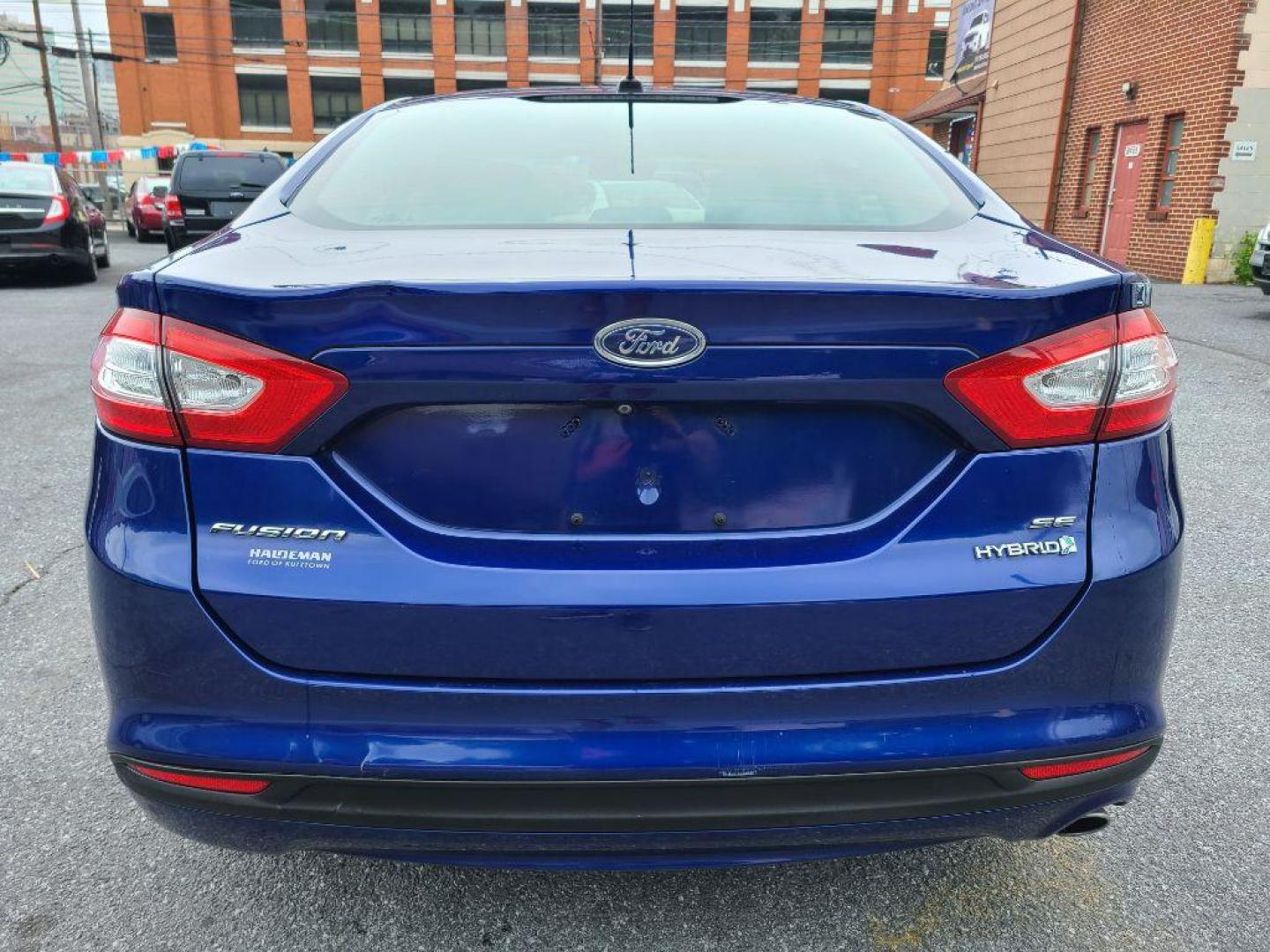 2014 BLUE FORD FUSION SE HYBRID (3FA6P0LU0ER) with an 2.0L engine, Continuously Variable transmission, located at 117 North Cameron Street, Harrisburg, PA, 17101, (717) 963-8962, 40.267021, -76.875351 - WE FINANCE!!! Good Credit/ Bad Credit/ No Credit - ALL Trade-Ins Welcomed!!! ***Guaranteed Credit Approval*** APPLY ONLINE or CALL us TODAY ;) Internet Prices and Marketplace Prices are SPECIAL discounted ***CASH DEALS*** Retail Prices are higher. Please call us to discuss your cash and finan - Photo#3