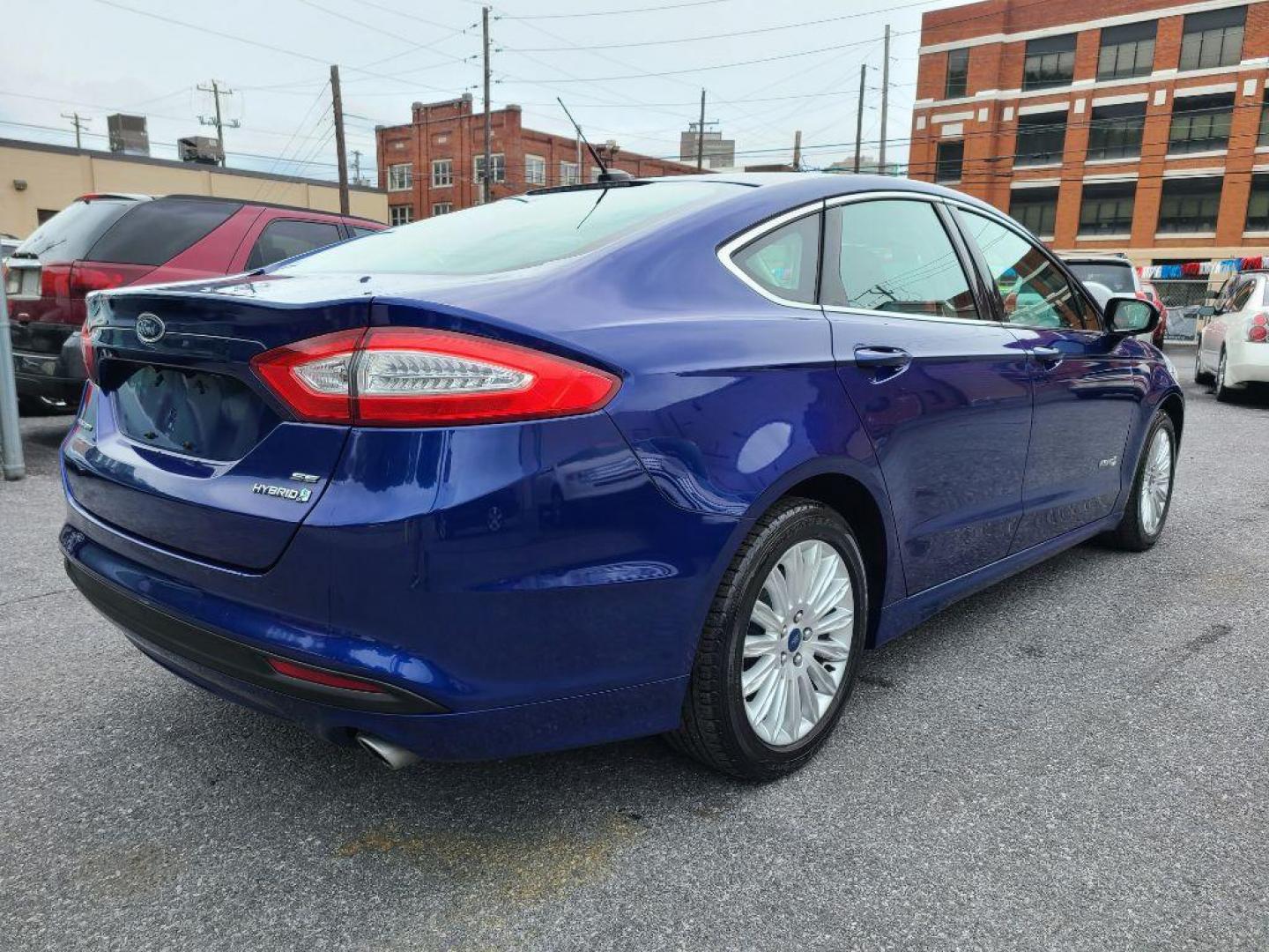 2014 BLUE FORD FUSION SE HYBRID (3FA6P0LU0ER) with an 2.0L engine, Continuously Variable transmission, located at 117 North Cameron Street, Harrisburg, PA, 17101, (717) 963-8962, 40.267021, -76.875351 - WE FINANCE!!! Good Credit/ Bad Credit/ No Credit - ALL Trade-Ins Welcomed!!! ***Guaranteed Credit Approval*** APPLY ONLINE or CALL us TODAY ;) Internet Prices and Marketplace Prices are SPECIAL discounted ***CASH DEALS*** Retail Prices are higher. Please call us to discuss your cash and finan - Photo#4