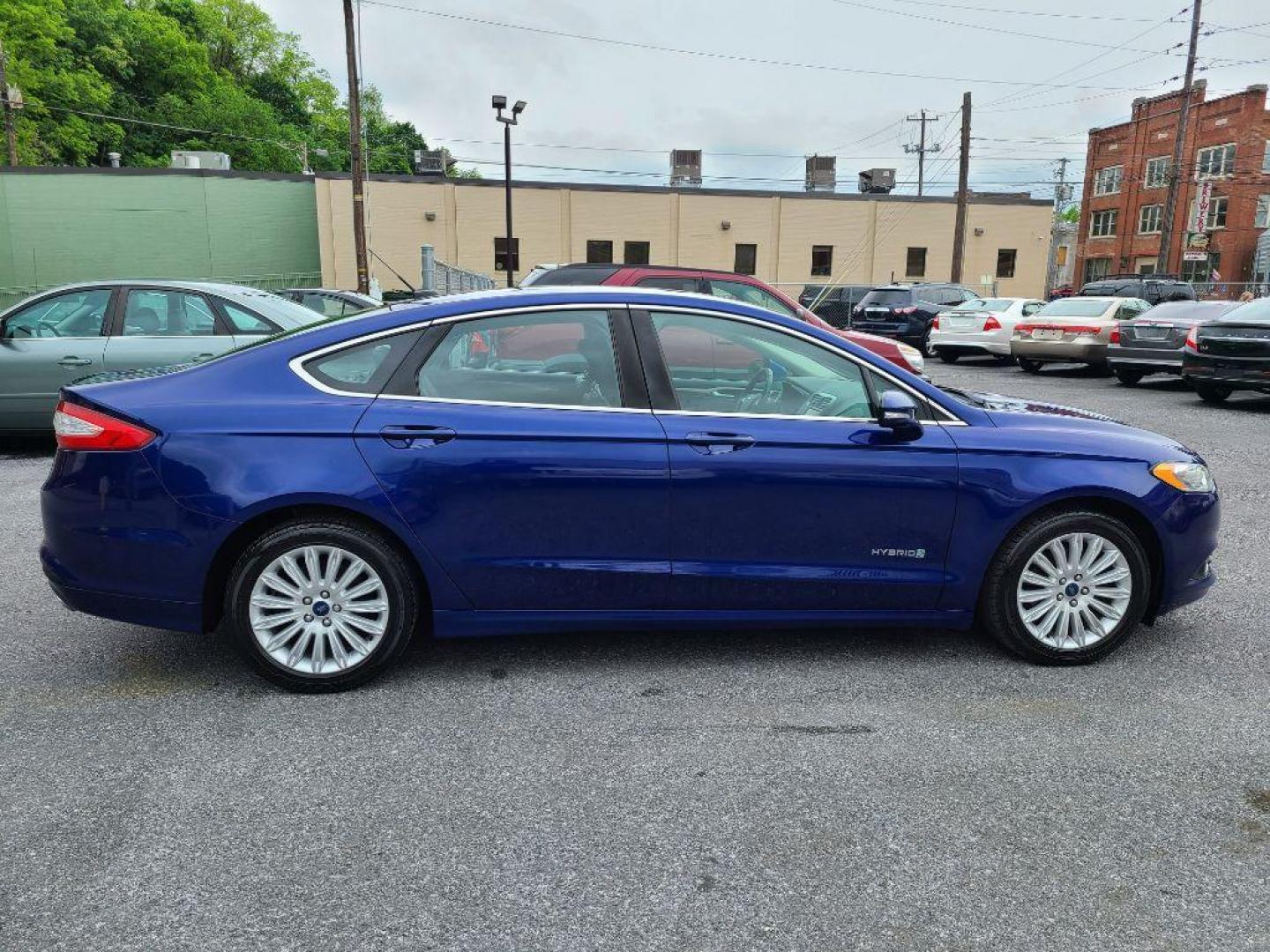 2014 BLUE FORD FUSION SE HYBRID (3FA6P0LU0ER) with an 2.0L engine, Continuously Variable transmission, located at 117 North Cameron Street, Harrisburg, PA, 17101, (717) 963-8962, 40.267021, -76.875351 - WE FINANCE!!! Good Credit/ Bad Credit/ No Credit - ALL Trade-Ins Welcomed!!! ***Guaranteed Credit Approval*** APPLY ONLINE or CALL us TODAY ;) Internet Prices and Marketplace Prices are SPECIAL discounted ***CASH DEALS*** Retail Prices are higher. Please call us to discuss your cash and finan - Photo#5