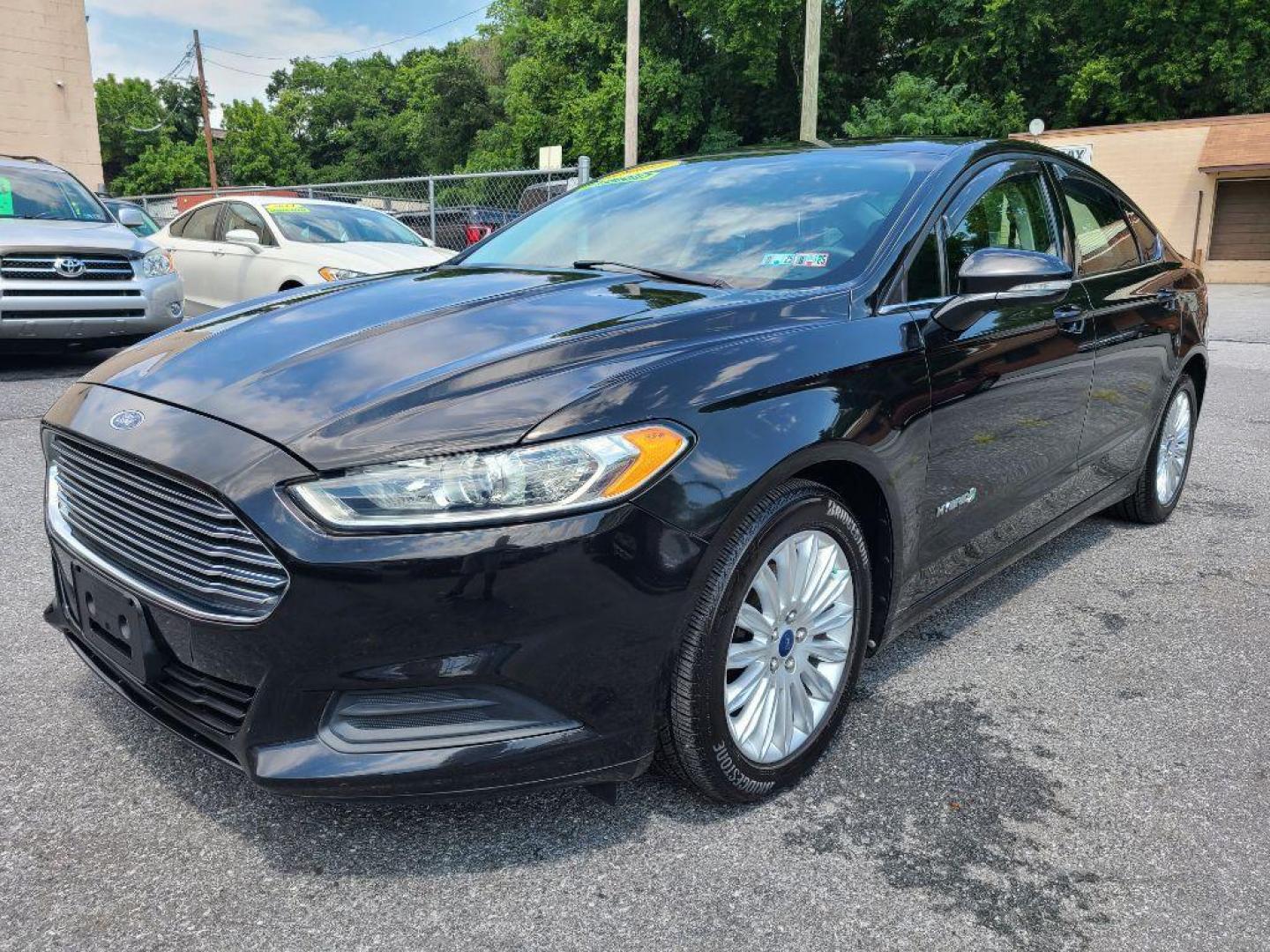 2014 BLACK FORD FUSION SE HYBRID (3FA6P0LU1ER) with an 2.0L engine, Continuously Variable transmission, located at 7981 Paxton Street, Harrisburg, PA, 17111, (717) 561-2926, 40.261490, -76.749229 - WE FINANCE!!! Good Credit/ Bad Credit/ No Credit - ALL Trade-Ins Welcomed!!! ***Guaranteed Credit Approval*** APPLY ONLINE or CALL us TODAY ;) Internet Prices and Marketplace Prices are SPECIAL discounted ***CASH DEALS*** Retail Prices are higher. Please call us to discuss your cash and finan - Photo#0