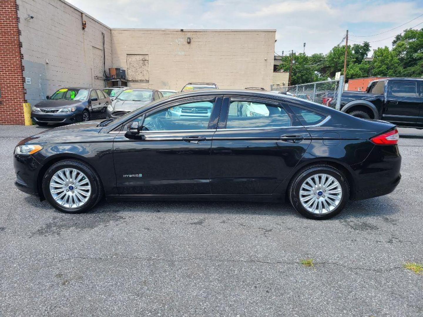 2014 BLACK FORD FUSION SE HYBRID (3FA6P0LU1ER) with an 2.0L engine, Continuously Variable transmission, located at 7981 Paxton Street, Harrisburg, PA, 17111, (717) 561-2926, 40.261490, -76.749229 - WE FINANCE!!! Good Credit/ Bad Credit/ No Credit - ALL Trade-Ins Welcomed!!! ***Guaranteed Credit Approval*** APPLY ONLINE or CALL us TODAY ;) Internet Prices and Marketplace Prices are SPECIAL discounted ***CASH DEALS*** Retail Prices are higher. Please call us to discuss your cash and finan - Photo#1