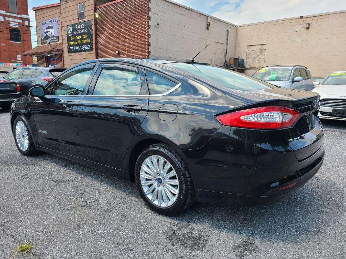 2014 BLACK FORD FUSION SE HYBRID (3FA6P0LU1ER) with an 2.0L engine, Continuously Variable transmission, located at 7981 Paxton Street, Harrisburg, PA, 17111, (717) 561-2926, 40.261490, -76.749229 - WE FINANCE!!! Good Credit/ Bad Credit/ No Credit - ALL Trade-Ins Welcomed!!! ***Guaranteed Credit Approval*** APPLY ONLINE or CALL us TODAY ;) Internet Prices and Marketplace Prices are SPECIAL discounted ***CASH DEALS*** Retail Prices are higher. Please call us to discuss your cash and finan - Photo#2