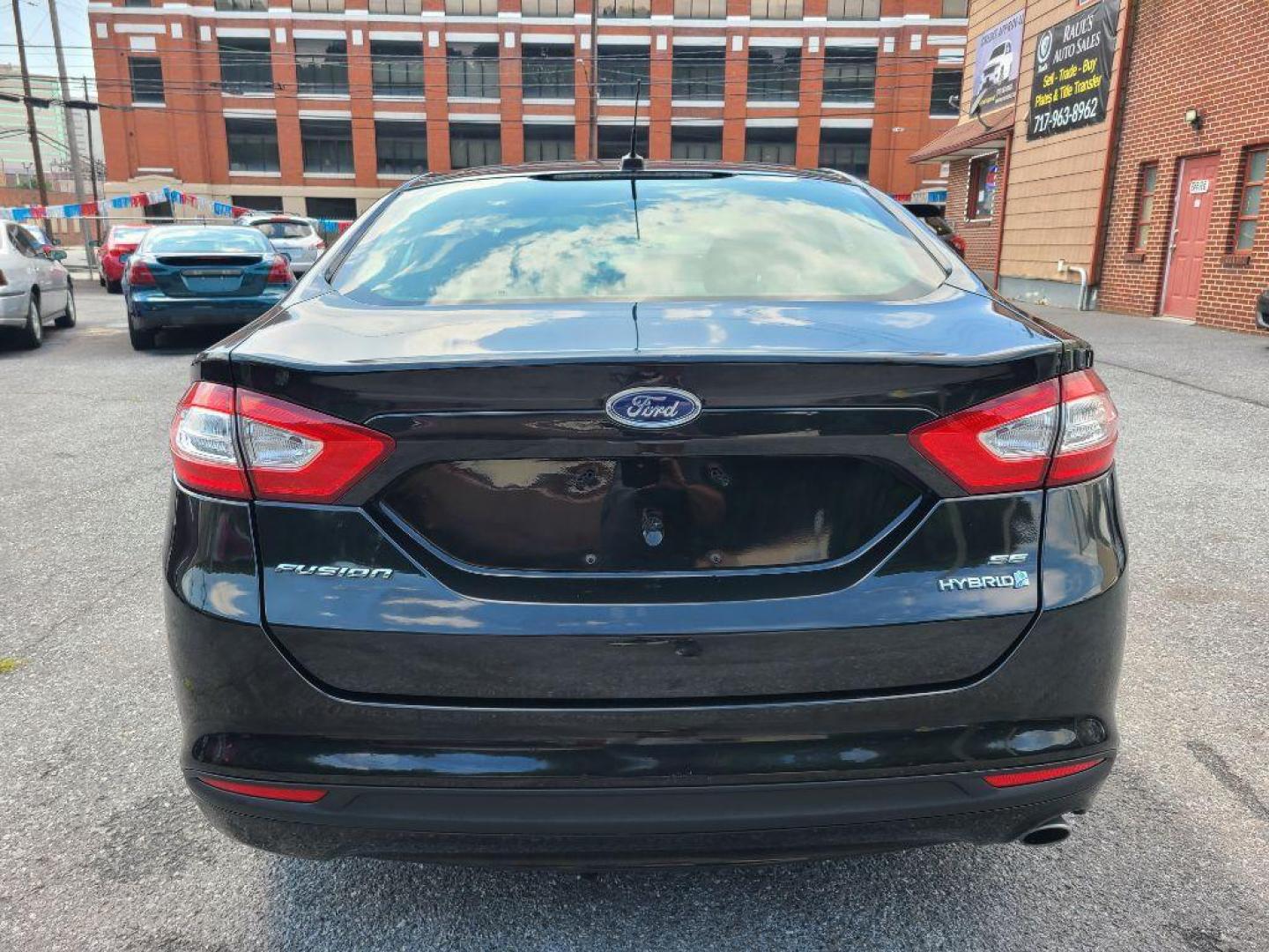 2014 BLACK FORD FUSION SE HYBRID (3FA6P0LU1ER) with an 2.0L engine, Continuously Variable transmission, located at 7981 Paxton Street, Harrisburg, PA, 17111, (717) 561-2926, 40.261490, -76.749229 - WE FINANCE!!! Good Credit/ Bad Credit/ No Credit - ALL Trade-Ins Welcomed!!! ***Guaranteed Credit Approval*** APPLY ONLINE or CALL us TODAY ;) Internet Prices and Marketplace Prices are SPECIAL discounted ***CASH DEALS*** Retail Prices are higher. Please call us to discuss your cash and finan - Photo#3