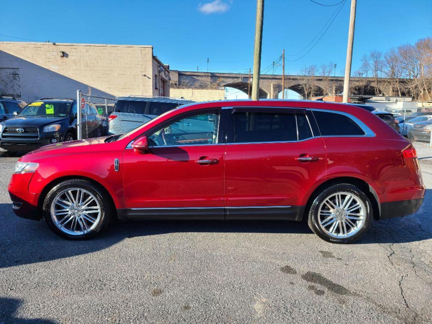 2014 RED LINCOLN MKT TILITY SUV AWD (2LMHJ5AT4EB) with an 3.5L engine, Automatic transmission, located at 7981 Paxton Street, Harrisburg, PA, 17111, (717) 561-2926, 40.261490, -76.749229 - WE FINANCE!!! Good Credit/ Bad Credit/ No Credit - ALL Trade-Ins Welcomed!!! ***Guaranteed Credit Approval*** APPLY ONLINE or CALL us TODAY ;) Internet Prices and Marketplace Prices are SPECIAL discounted ***CASH DEALS*** Retail Prices are higher. Please call us to discuss your cash and finan - Photo#1