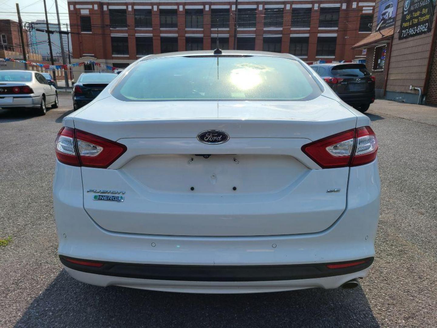 2016 WHITE FORD FUSION SE PHEV (3FA6P0PU6GR) with an 2.0L engine, Continuously Variable transmission, located at 7981 Paxton Street, Harrisburg, PA, 17111, (717) 561-2926, 40.261490, -76.749229 - WE FINANCE!!! Good Credit/ Bad Credit/ No Credit - ALL Trade-Ins Welcomed!!! ***Guaranteed Credit Approval*** APPLY ONLINE or CALL us TODAY ;) Internet Prices and Marketplace Prices are SPECIAL discounted ***CASH DEALS*** Retail Prices are higher. Please call us to discuss your cash and finan - Photo#3