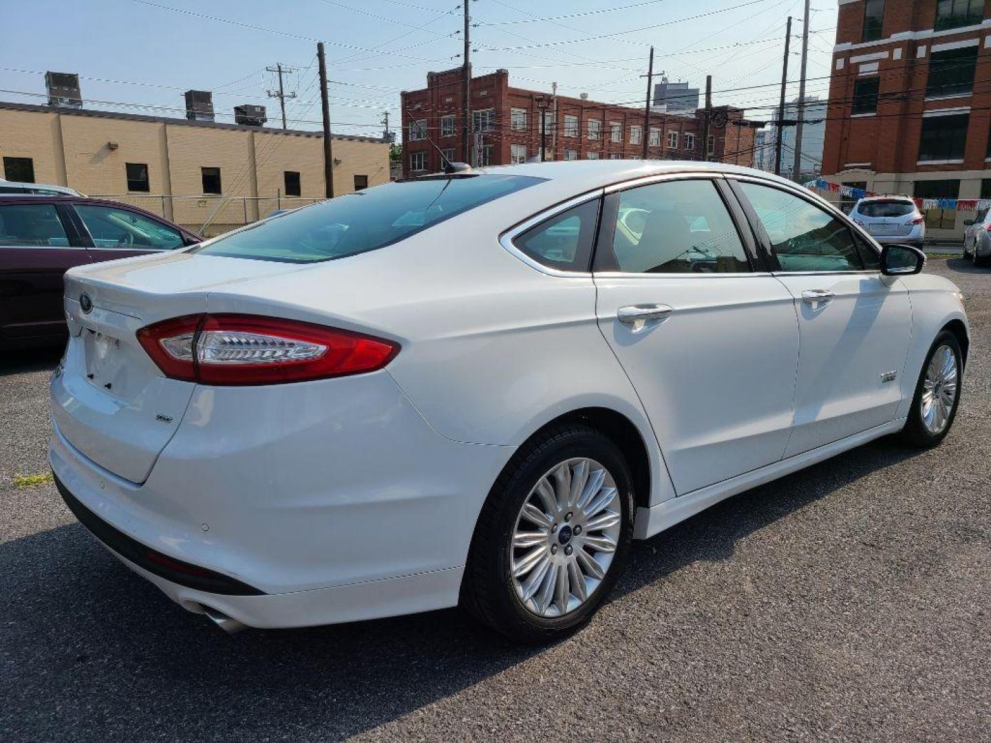 2016 WHITE FORD FUSION SE PHEV (3FA6P0PU6GR) with an 2.0L engine, Continuously Variable transmission, located at 7981 Paxton Street, Harrisburg, PA, 17111, (717) 561-2926, 40.261490, -76.749229 - WE FINANCE!!! Good Credit/ Bad Credit/ No Credit - ALL Trade-Ins Welcomed!!! ***Guaranteed Credit Approval*** APPLY ONLINE or CALL us TODAY ;) Internet Prices and Marketplace Prices are SPECIAL discounted ***CASH DEALS*** Retail Prices are higher. Please call us to discuss your cash and finan - Photo#4