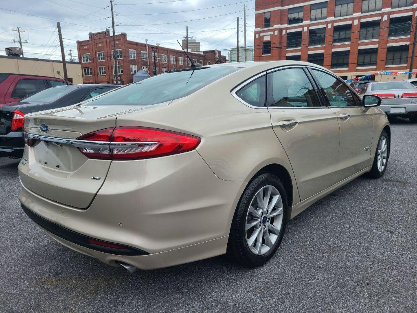 2017 TAN FORD FUSION SE PHEV (3FA6P0PU2HR) with an 2.0L engine, Continuously Variable transmission, located at 117 North Cameron Street, Harrisburg, PA, 17101, (717) 963-8962, 40.267021, -76.875351 - WE FINANCE!!! Good Credit/ Bad Credit/ No Credit - ALL Trade-Ins Welcomed!!! ***Guaranteed Credit Approval*** APPLY ONLINE or CALL us TODAY ;) Internet Prices and Marketplace Prices are SPECIAL discounted ***CASH DEALS*** Retail Prices are higher. Please call us to discuss your cash and finan - Photo#4